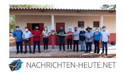 Logo Nachrichten-heute-net und Bild vom Team vor neuer Krankenstation